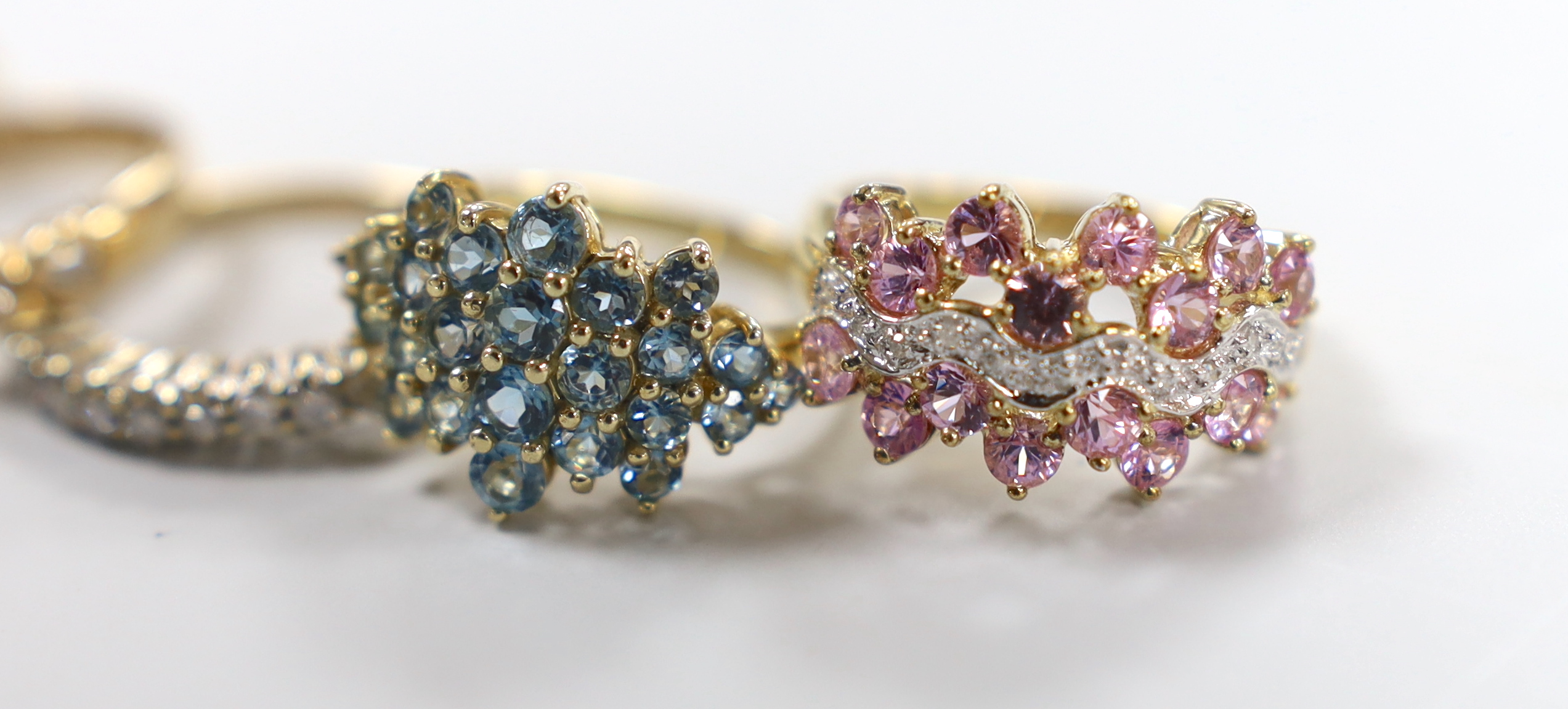 Five assorted modern 9ct gold and gem set rings, including two diamond set half hoop, gross weight 15.8 grams.